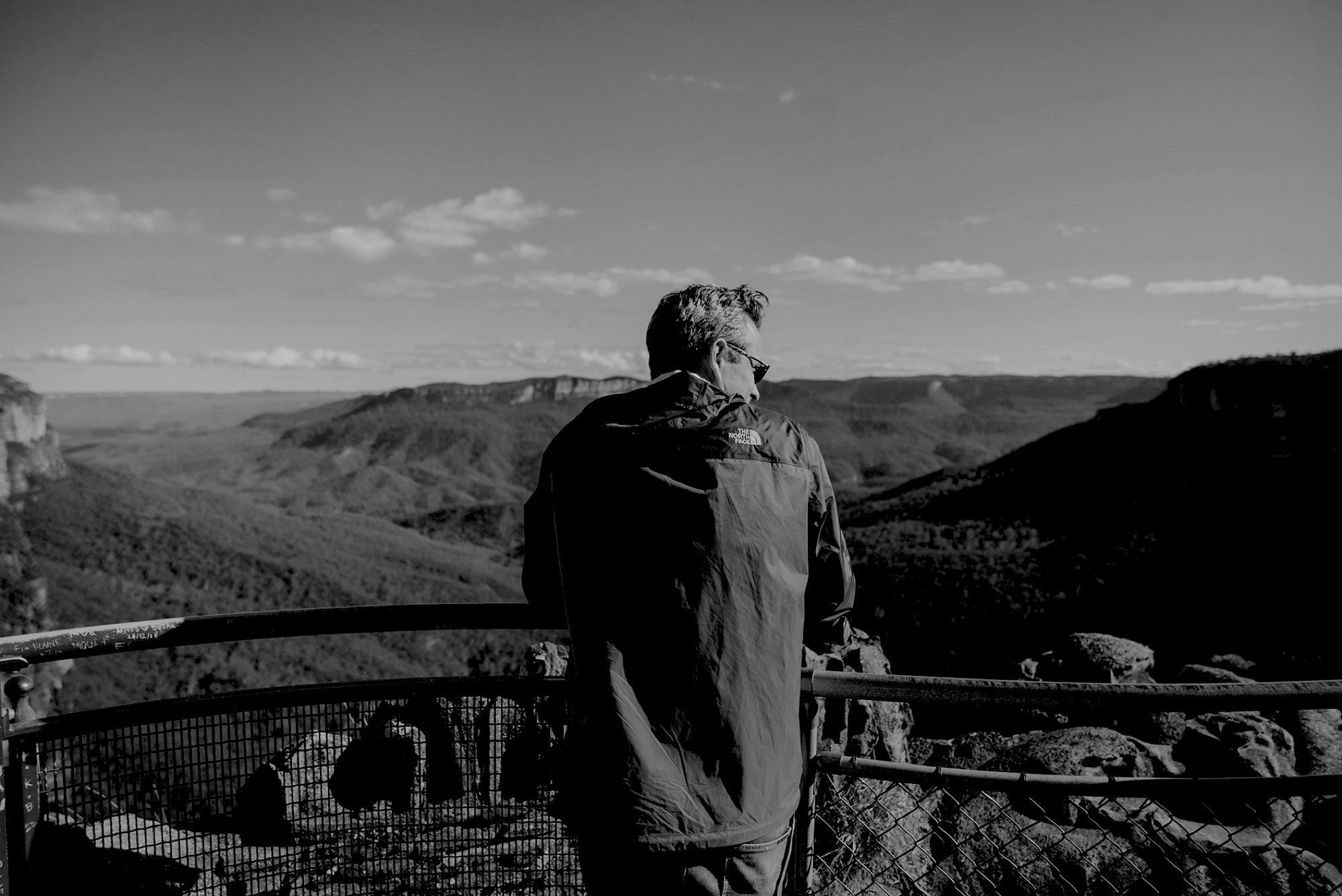 A figure at a lookout above the valley